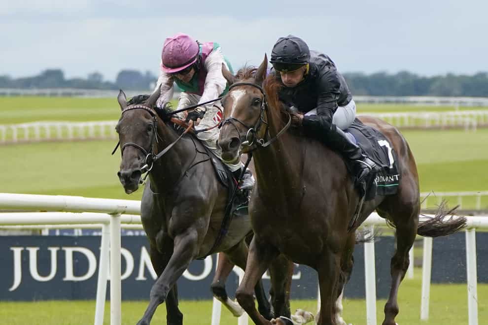 Savethelastdance (right) and Bluestocking fight out the finish to the Irish Oaks (Niall Carson/PA)