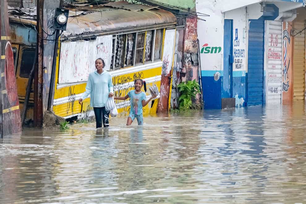 Tropical Storm Franklin roared towards the island of Hispaniola, shared by the Dominican Republic and Haiti, on Wednesday, sparking fears it will trigger heavy flooding and deadly landslides in both countries (Ricardo Hernandez/AP)