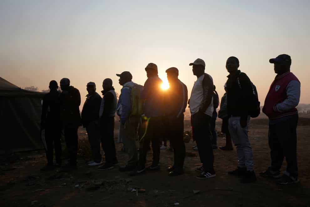 Voters wait to cast their votes in Harare (Tsvangirayi Mukwazhi/AP)