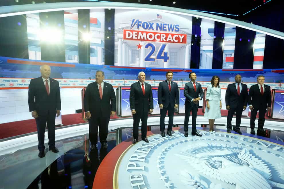 Republican presidential candidates, from left, former Arkansas governor Asa Hutchinson, former New Jersey governor Chris Christie, former vice president Mike Pence, Florida governor Ron DeSantis, businessman Vivek Ramaswamy, former UN ambassador Nikki Haley, Senator Tim Scott and North Dakota governor Doug Burgum stand on stage before a Republican presidential primary debate hosted by Fox News Channel in Milwaukee (Morry Gash/AP)