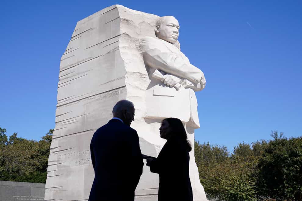 Joe Biden and Kamala Harris stand together at the Martin Luther King, Jr Memorial (AP)