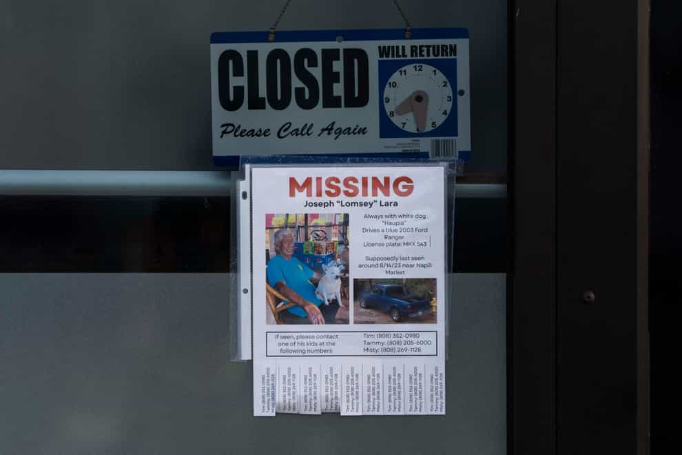 A missing person flyer on the door of a business in a shopping centre in Lahaina (AP Photo/Jae C. Hong)