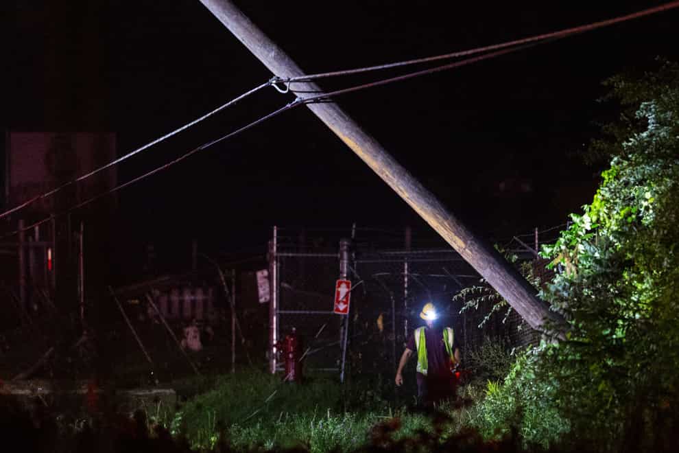 Power lines were brought down by the storm (Joel Bissell/Kalamazoo Gazette via AP)