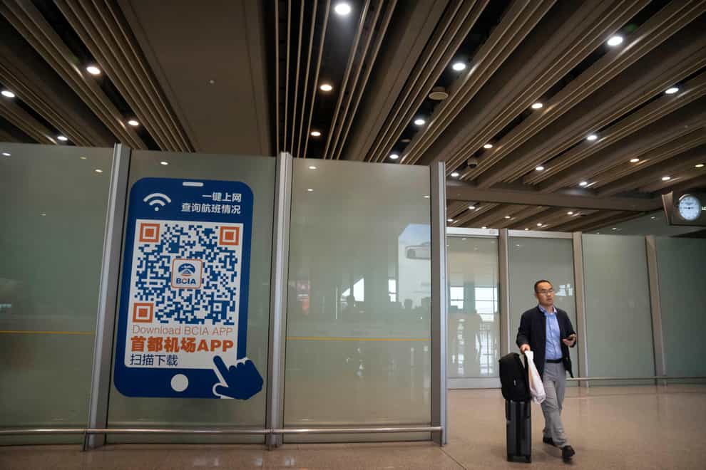 China is ending its requirement for a negative Covid-19 test result from incoming travellers (AP Photo/Mark Schiefelbein, File)