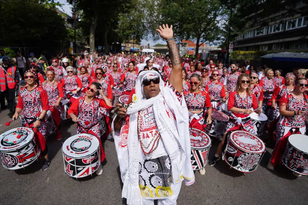Participants pass through Westbourne Park during the adult parade, part of the Notting Hill Carnival (James Manning/PA)