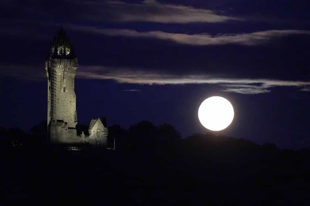 The super blue moon rises over The Wallace Monument in Stirling (Andrew Milligan/PA)