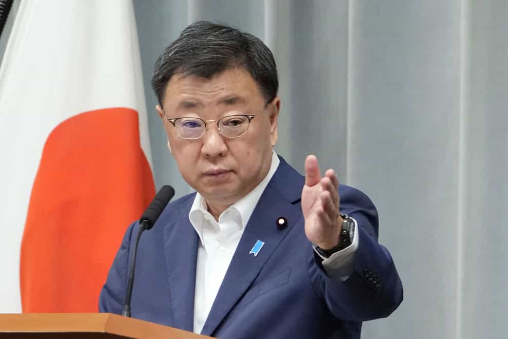 Japan’s chief cabinet Secretary Hirokazu Matsuno announced the move (Kyodo News via AP)