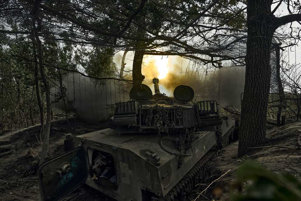 A Ukrainian self-propelled artillery system fires towards Russian positions at the front line near Bakhmut (AP Photo/Libkos)