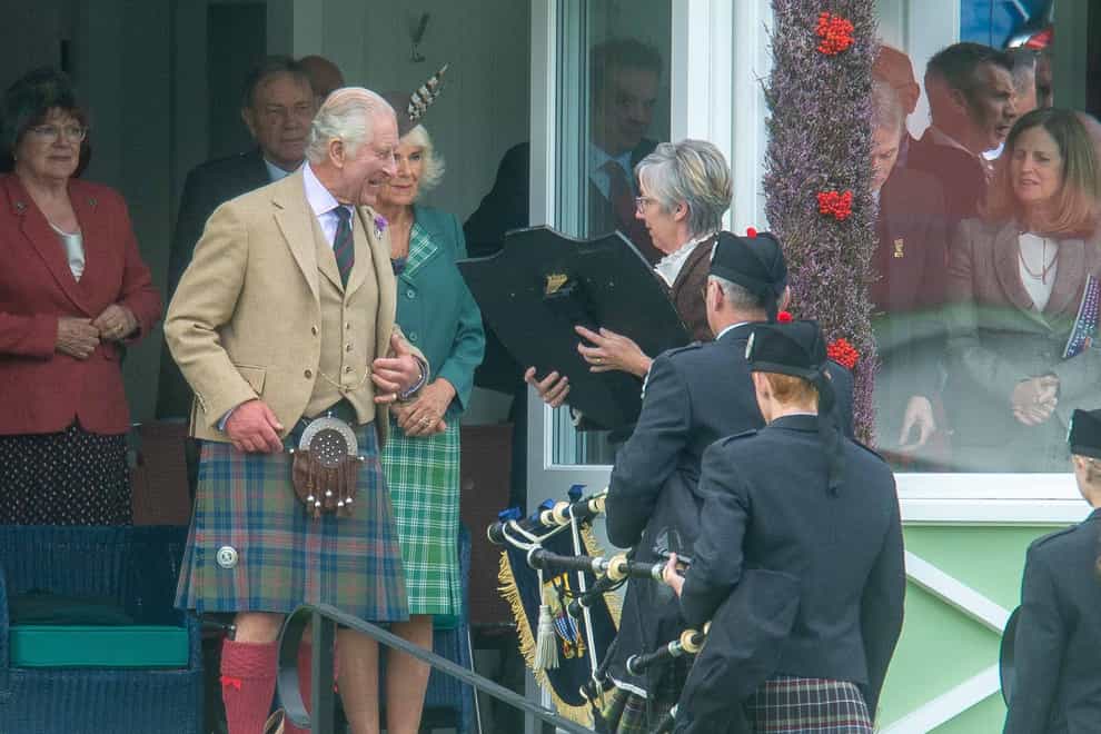 The King handed over the plaque during the Braemar Gathering (Michael Traill/PA)