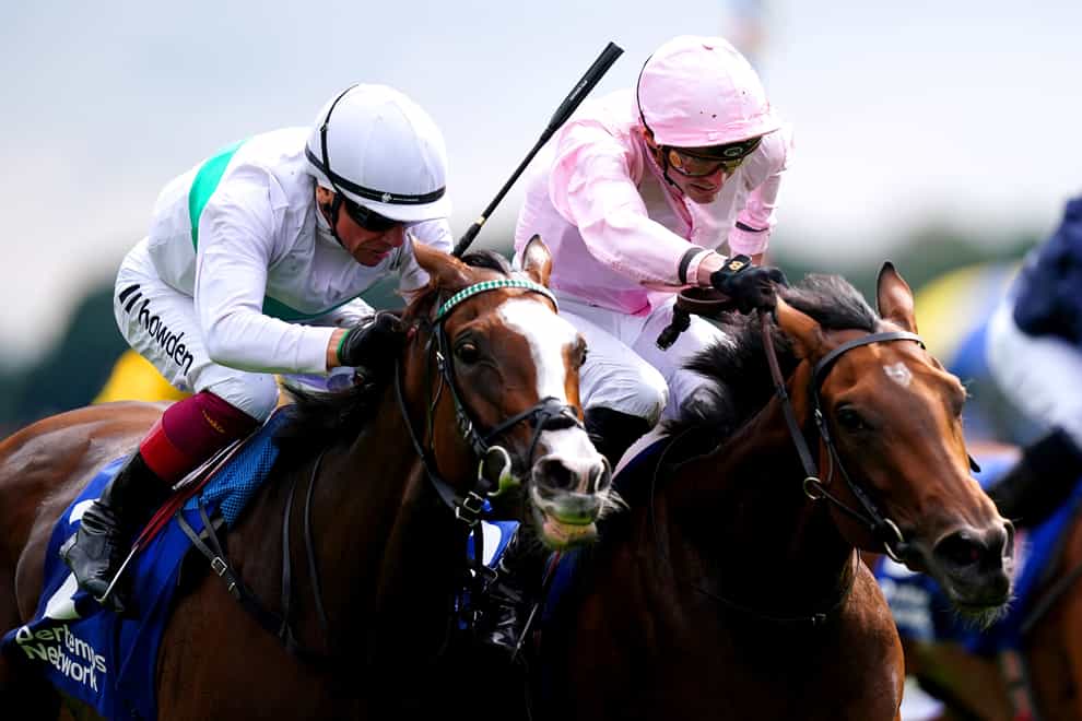 Warm Heart ridden by jockey James Doyle (right) on their way to winning the Pertemps Network Yorkshire Oaks on day two of the Sky Bet Ebor Festival at York Racecourse. Picture date: Thursday August 24, 2023.