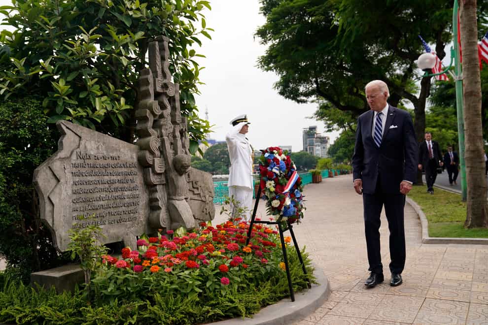 Joe Biden visits the John McCain memorial in Hanoi (AP)