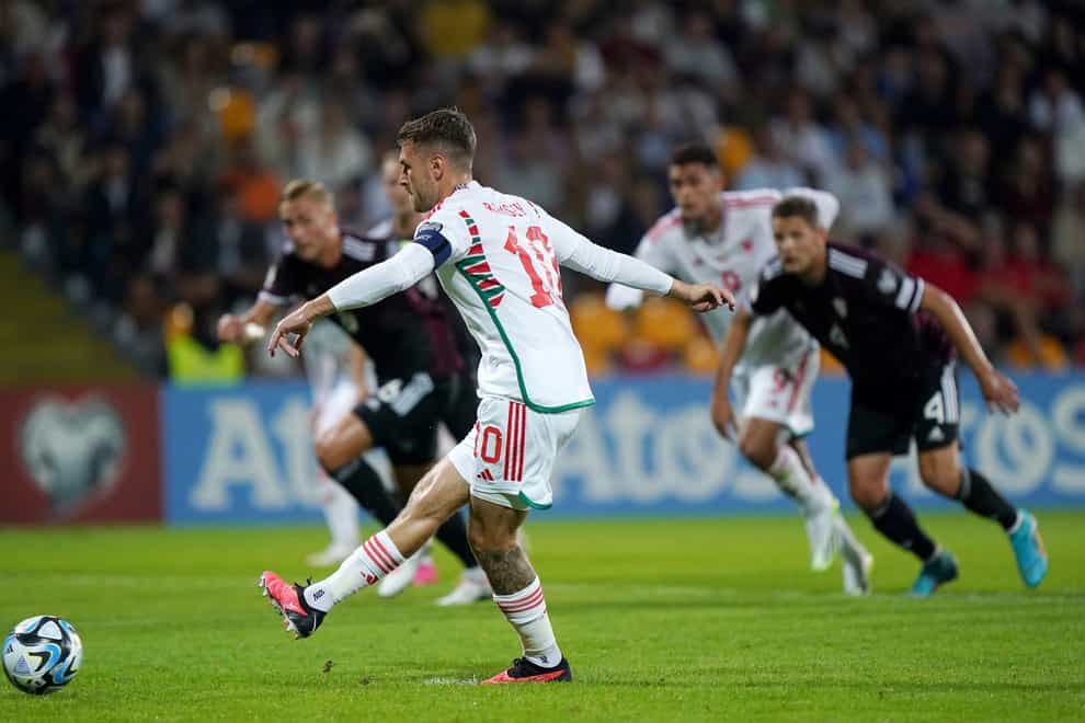 Wales’ Aaron Ramsey scores his side’s opener against Latvia (Tim Goode/PA)