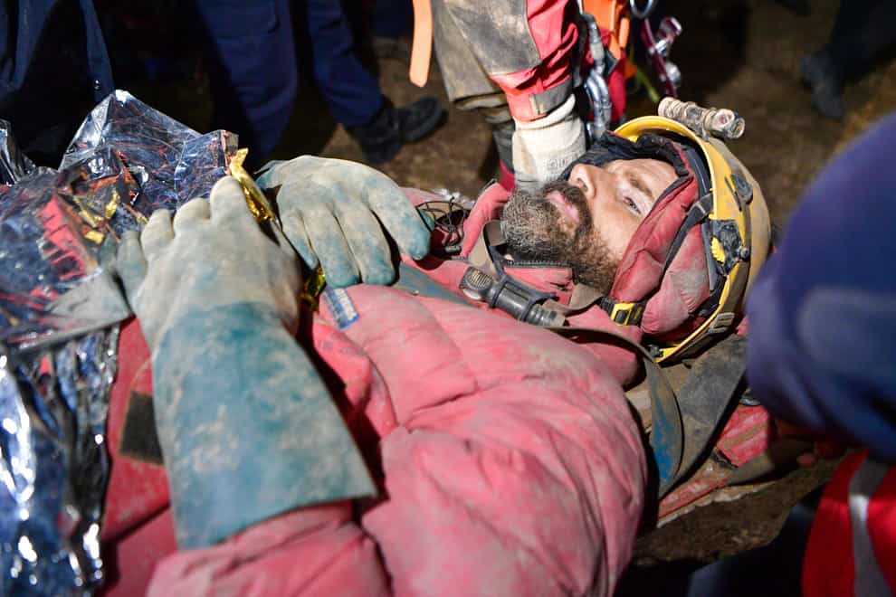 American researcher Mark Dickey is carried on a stretcher after being pulled out of Morca cave (Mert Gokhan Koc/Dia Images via AP)