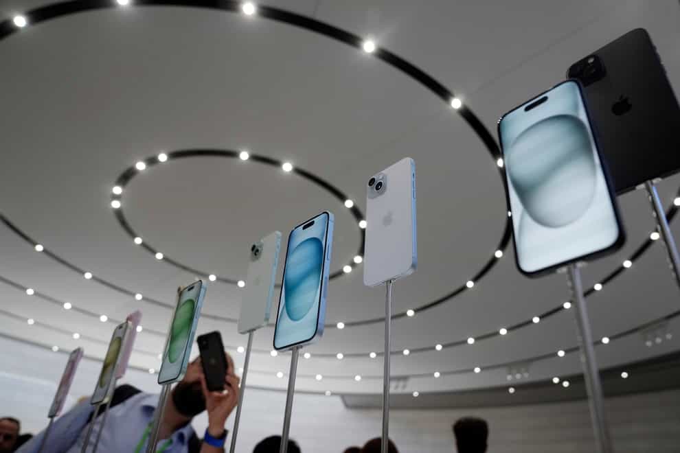 iPhone 15 and 15 Plus models are displayed during an announcement of new products on the Apple campus in California (AP Photo/Jeff Chiu)