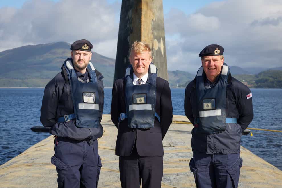 Deputy Prime Minister Oliver Dowden (centre) welcomed the submarine home (Bill Spurr/Royal Navy/PA)