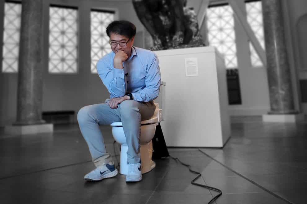 Seung-min Park with the Smart Healthcare toilet at Stanford University (Ig Nobel/Seung-min Park/Stanford University/PA)
