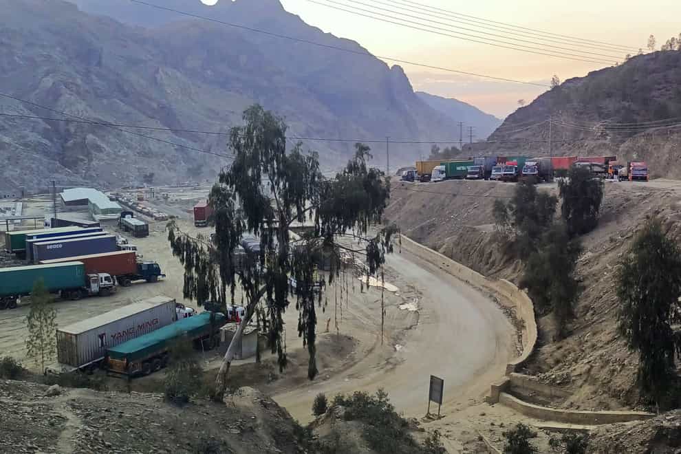 Stranded trucks loaded with supplies for Afghanistan, park in a terminal along side on a highway after Afghan Taliban rulers closed a key border crossing point Torkham, in Landi Kotal (AP)