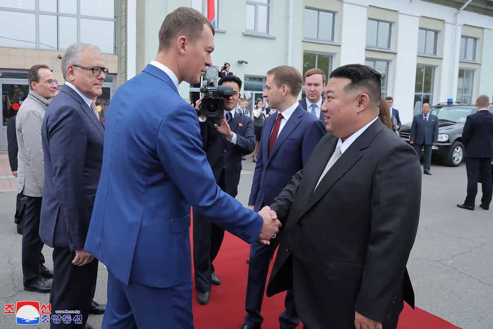 Photo provided by the North Korean government of North Korean leader Kim Jong Un greeted by Governor of Khabarovsky Krai region Mikhail Degtyarev on the arrival at a station in Komsomolsk-on-Amu (Korean Central News Agency/Korea News Service/AP)