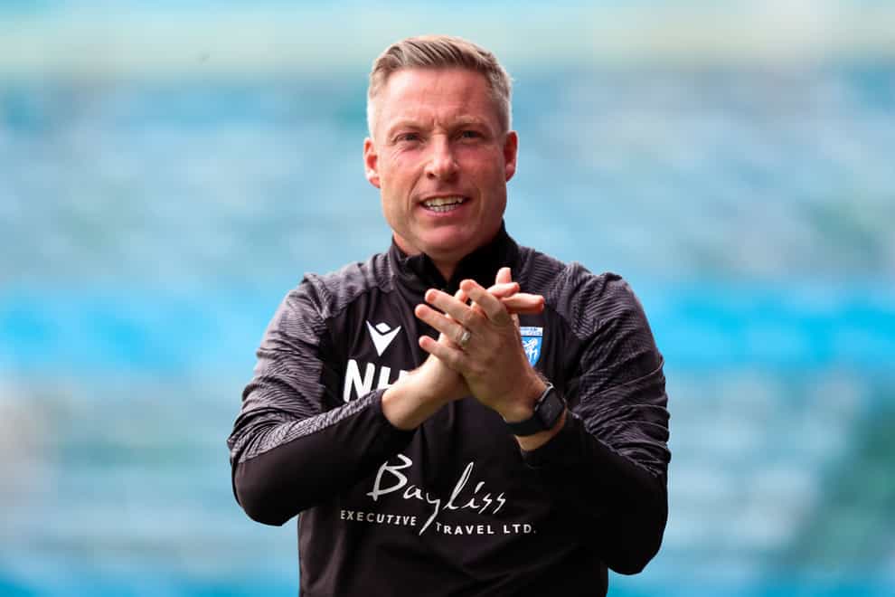 Neil Harris saw his Gillingham side return to the top of the table (Rhianna Chadwick/PA).