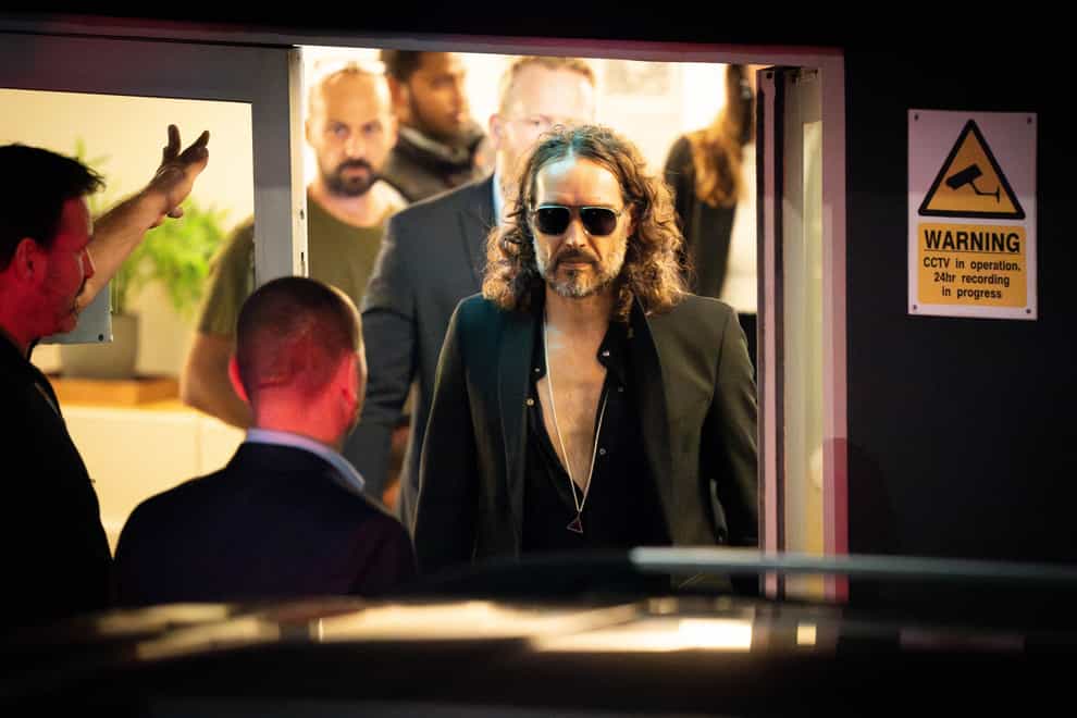 Russell Brand leaves the Troubabour Wembley Park theatre (James Manning/PA)
