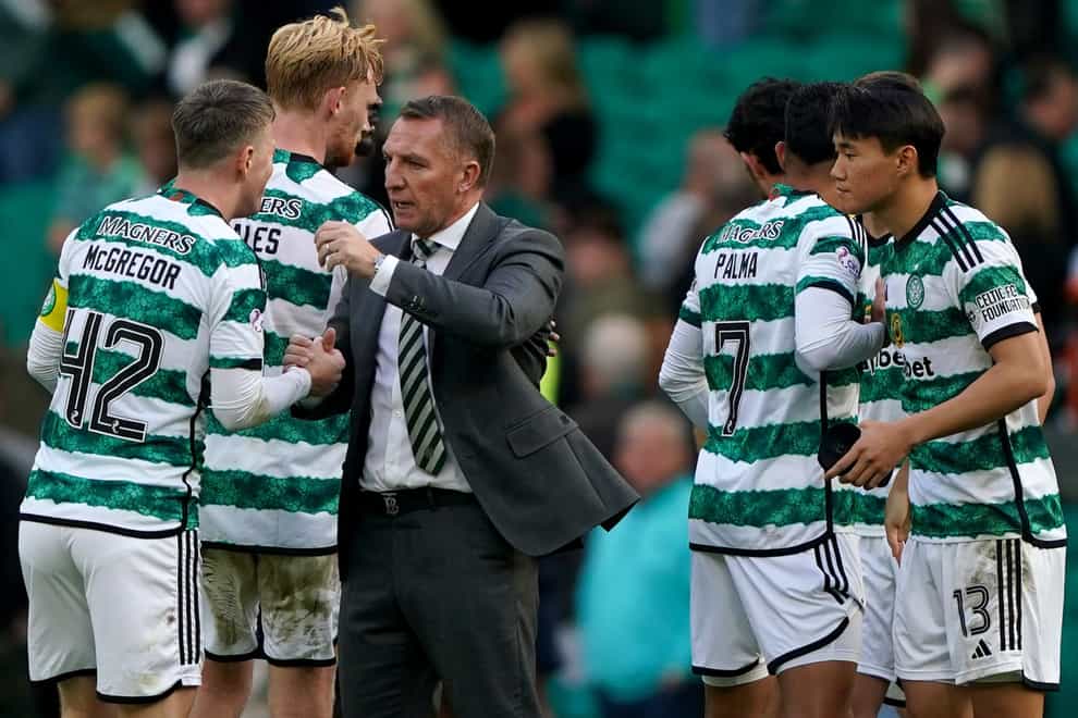 Brendan Rodgers with some of his players after Saturday’s win against Dundee (Andrew Milligan/PA)
