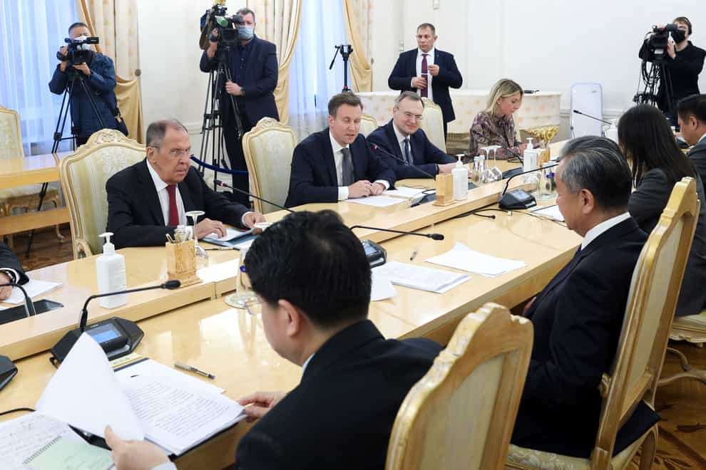 Russian Foreign Minister Sergei Lavrov, left, speaks to Chinese Foreign Minister Wang Yi during their talks in Moscow, Russia, on Monday (Russian Foreign Ministry Press Service via AP/PA)