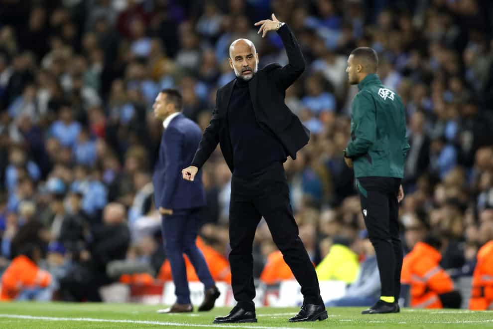 Pep Guardiola gestures during the win over Red Star Belgrade (Nigel French/PA)