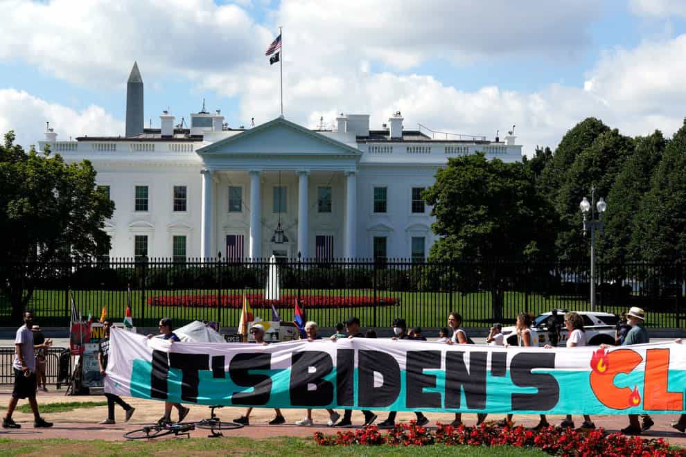 Climate activists rallying in front of the White House in July to demand that President Joe Biden declare a climate emergency and move the country rapidly away from fossil fuels (Yuri Gripas/AP/PA)