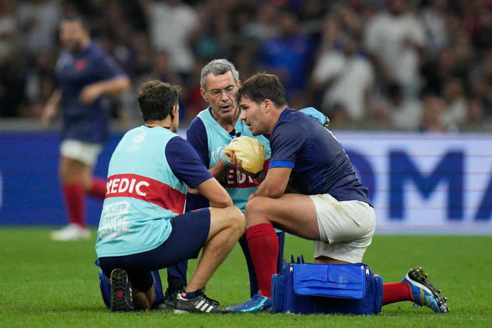 Antoine Dupont receives treatment during France’s game against Namibia (Daniel Cole/AP)