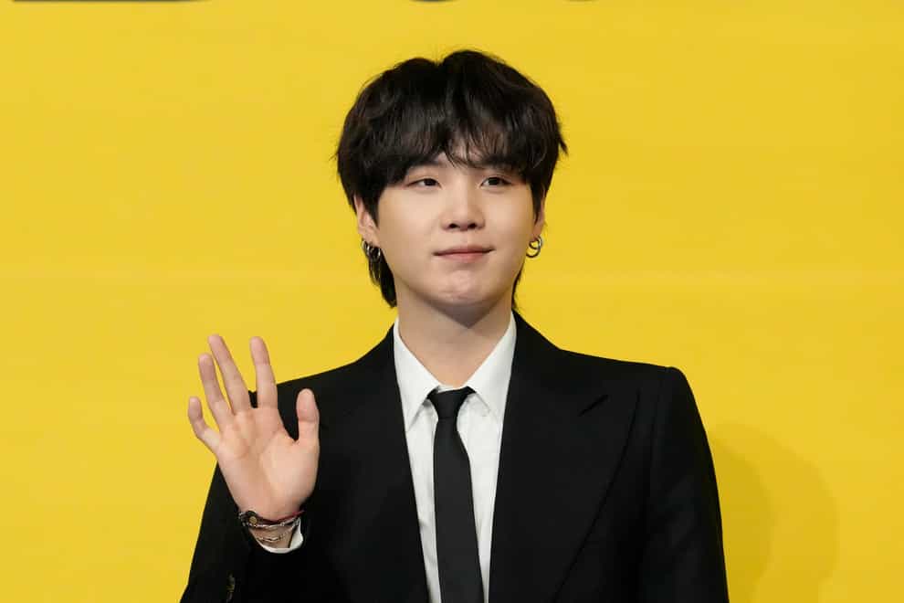 Suga from the K-pop supergroup BTS has begun fulfilling his mandatory military duty as a social service agent – an alternative form of military service in the country (Lee Jin-man/AP)
