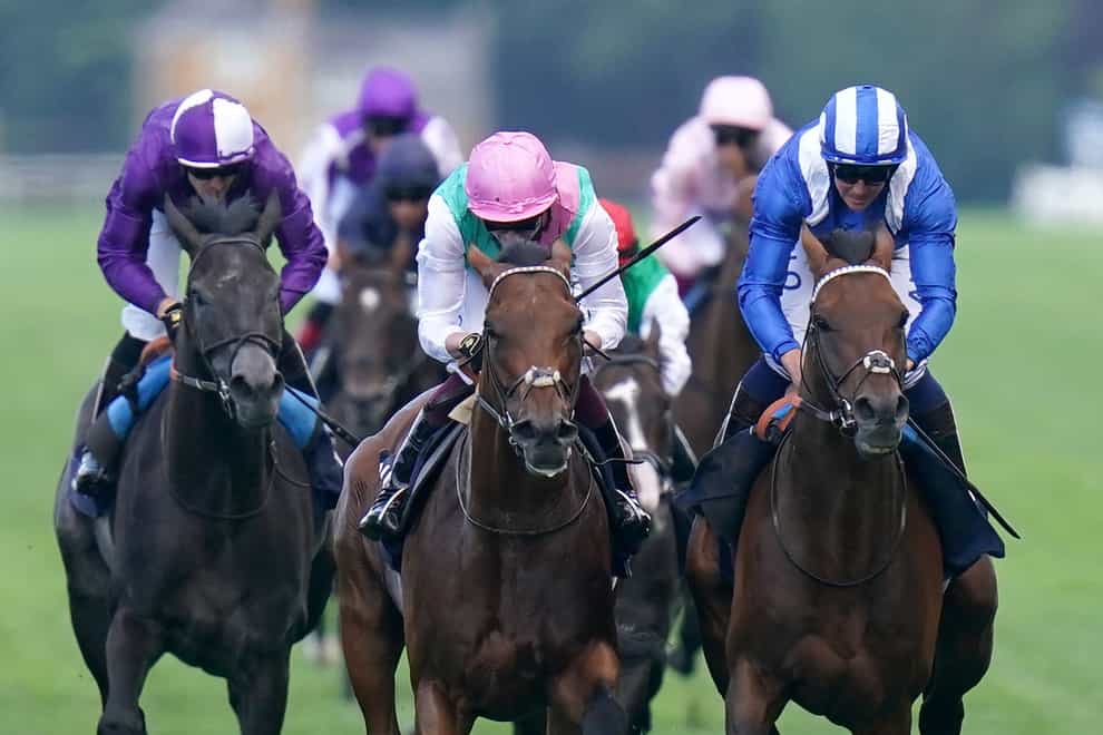 Hukum (right) and Westover (pink hat) fight out the finish to the King George at Ascot (Adam Davy/PA)