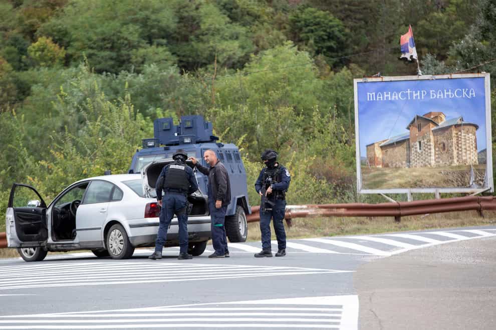 Kosovo police search vehicles at a crossroads leading to the Banjska Monastery (Visar Kryeziu/AP)