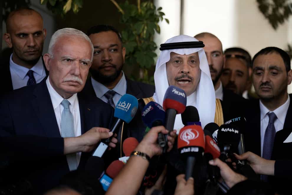 Nayef al-Sudairi, the first-ever Saudi ambassador to the Palestinian Authority, right, and Palestinian Minister of Foreign Affairs and Expatriates, Dr Riyad Al-Maliki, left, make a joint statement after their meeting in Ramallah on Tuesday (Majdi Mohammed/AP/PA)