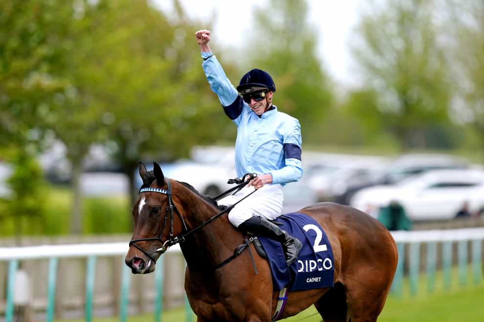 James Doyle celebrates on Cachet after winning the Qipco 1000 Guineas (David Davies/PA)