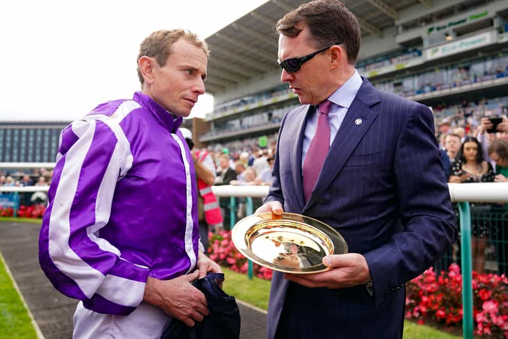 Ryan Moore and trainer Aidan O’Brien after winning the Betfred St Leger Stakes on Continuous during the Betfred St Leger Festival at Doncaster Racecourse. Picture date: Saturday September 16, 2023.
