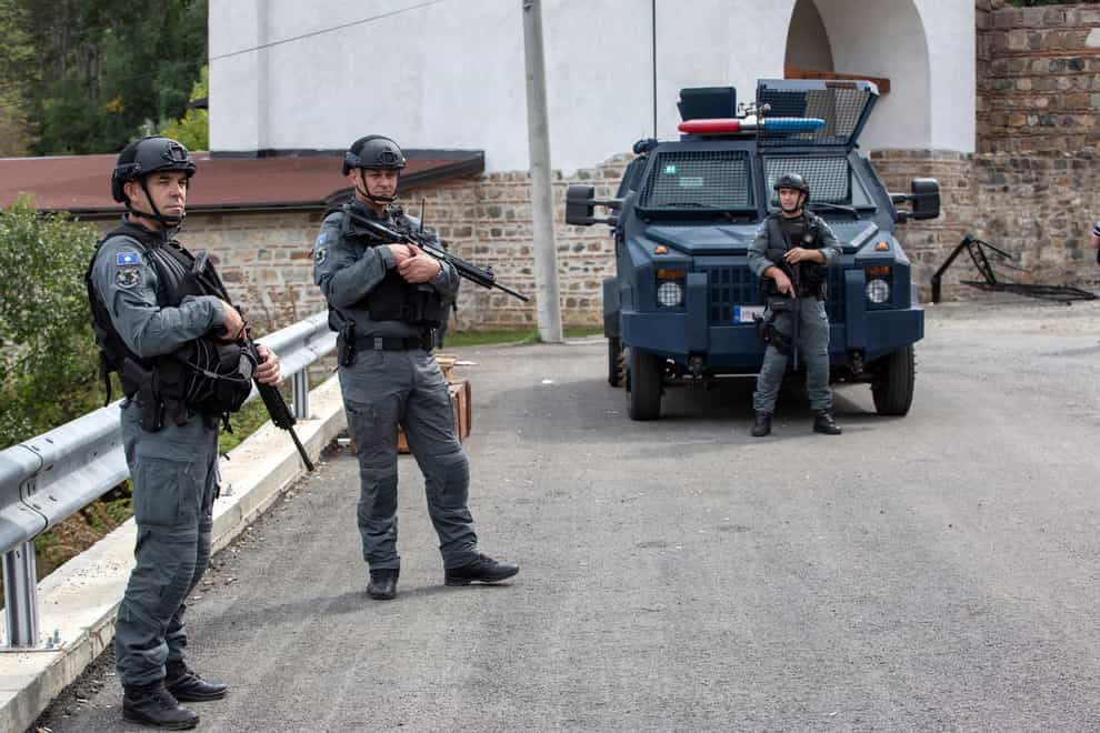 Kosovo police officers have carried out searches (Visar Kryeziu/AP)