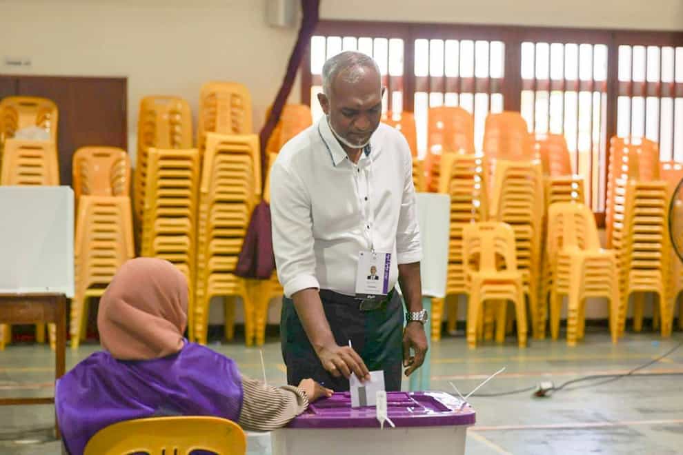 The Maldives’ main opposition candidate Mohamed Muiz casts his vote in Male (AP/PA)
