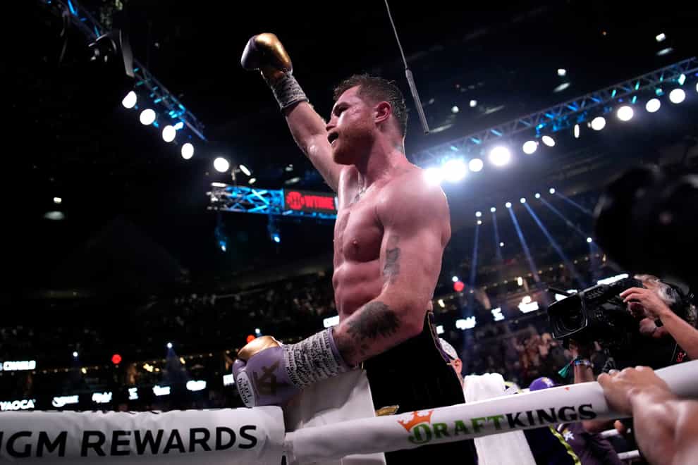Canelo Alvarez, of Mexico, celebrates after defeating Jermell Charlo in their super middleweight title boxing match (John Locher, AP)
