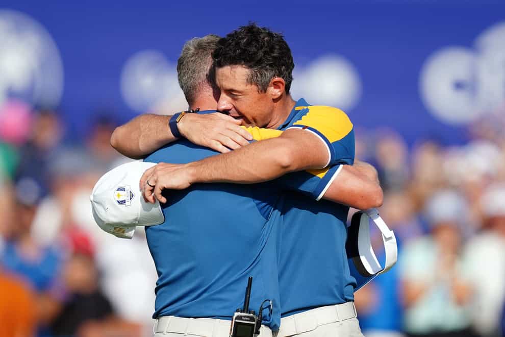 Team Europe’s Rory McIlroy with Captain Luke Donald following his singles match (Mike Egerton/PA)