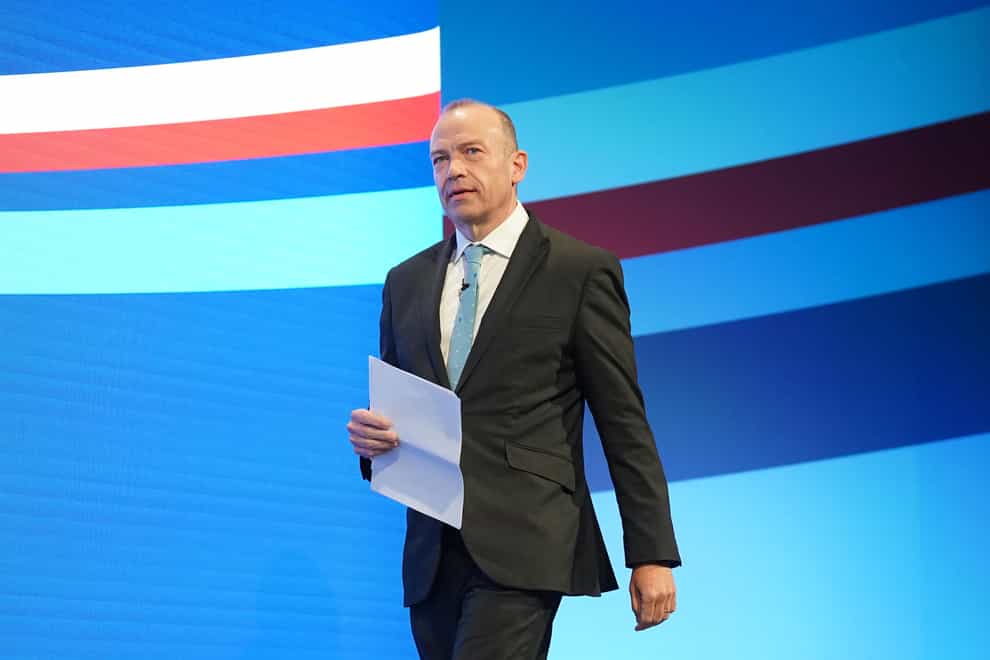 Northern Ireland Secretary Chris Heaton-Harris walks on stage during the Conservative Party annual conference at Manchester Central (Stefan Rousseau/PA)