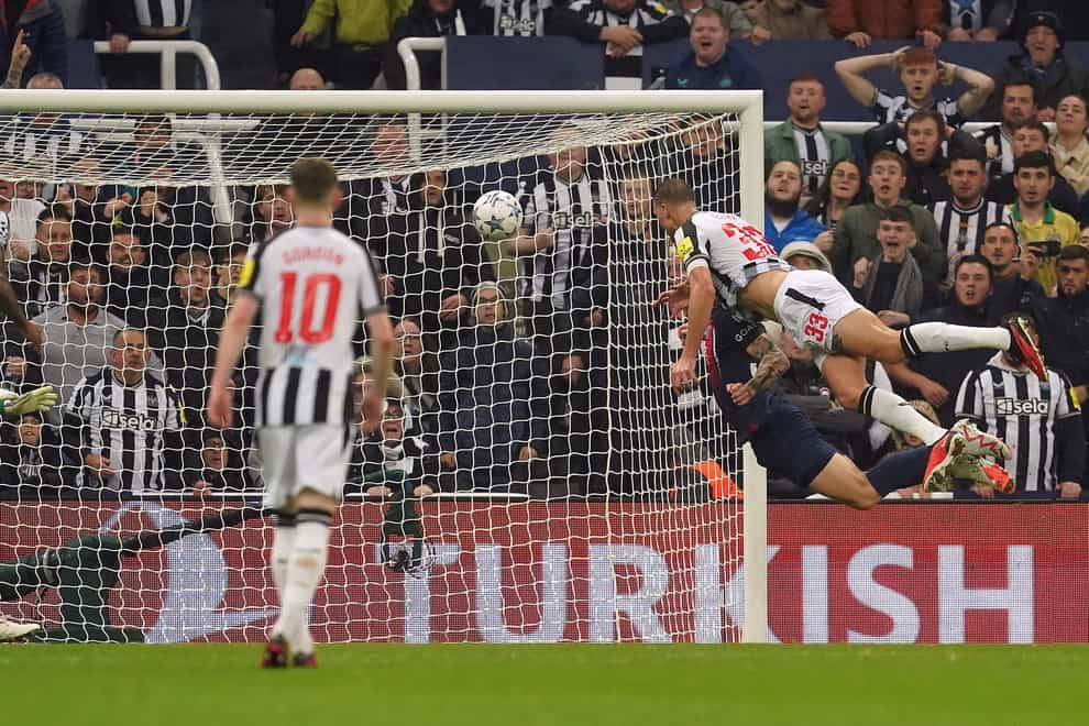 Dan Burn heads Newcastle into a 2-0 Champions League lead over Paris St Germain (Martin Rickett/PA)