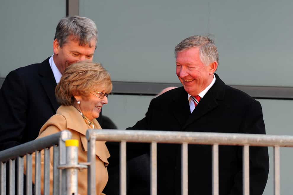 <p>Lady Cathy Ferguson, front left, talked her husband Sir Alex out of retirement in 2002 (Martin Rickett/PA)</p>