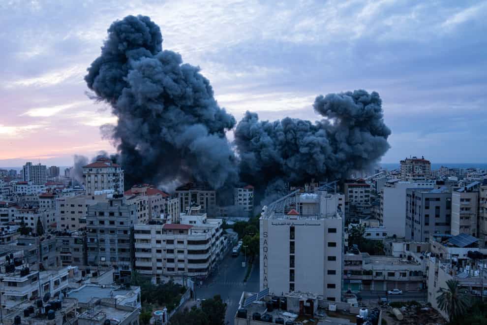 Smoke rises following an Israeli airstrike in Gaza City (Fatima Shbair/AP)