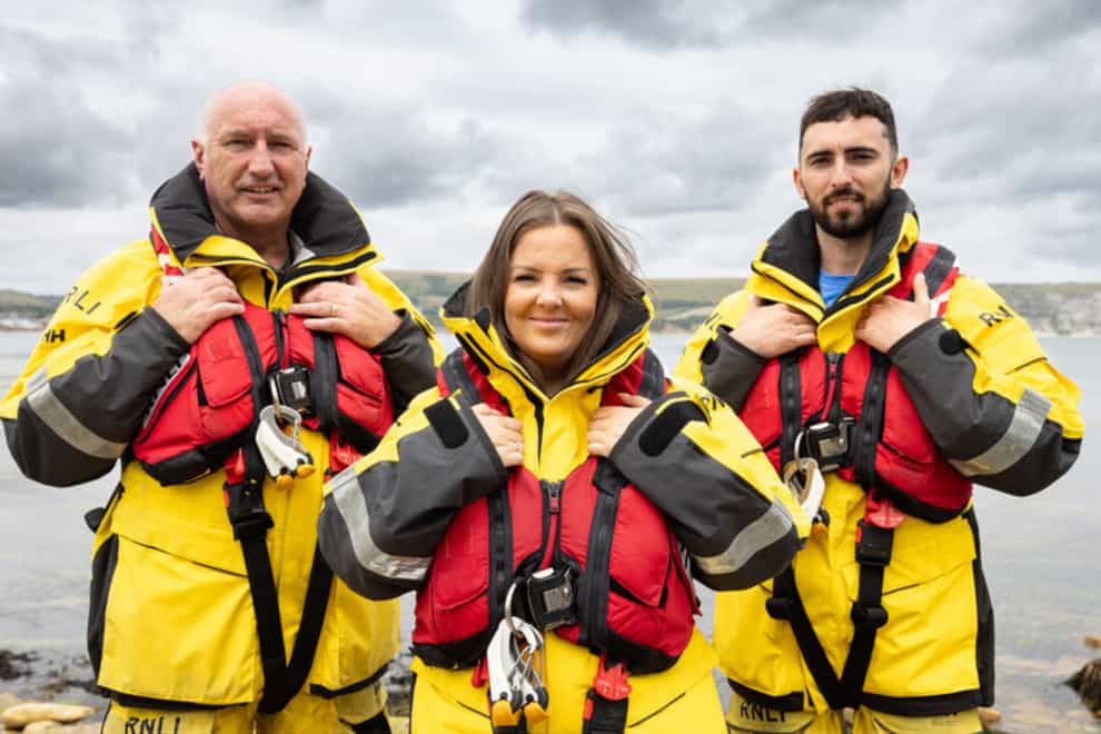 Frank Healy, Sami Agnew and Jack Healy volunteer for RNLI Larne (RNLI/Charlotte Cranny-Evans/PA)
