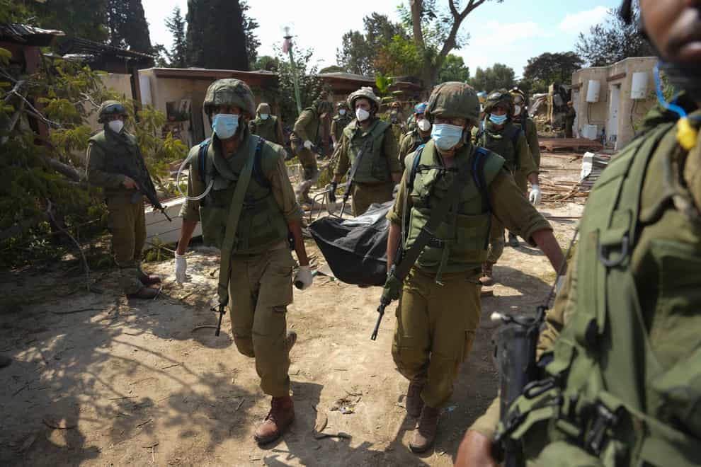 Hundreds of Israeli soldiers, in helmets and body armour, were deployed to the village (Erik Marmor/AP)