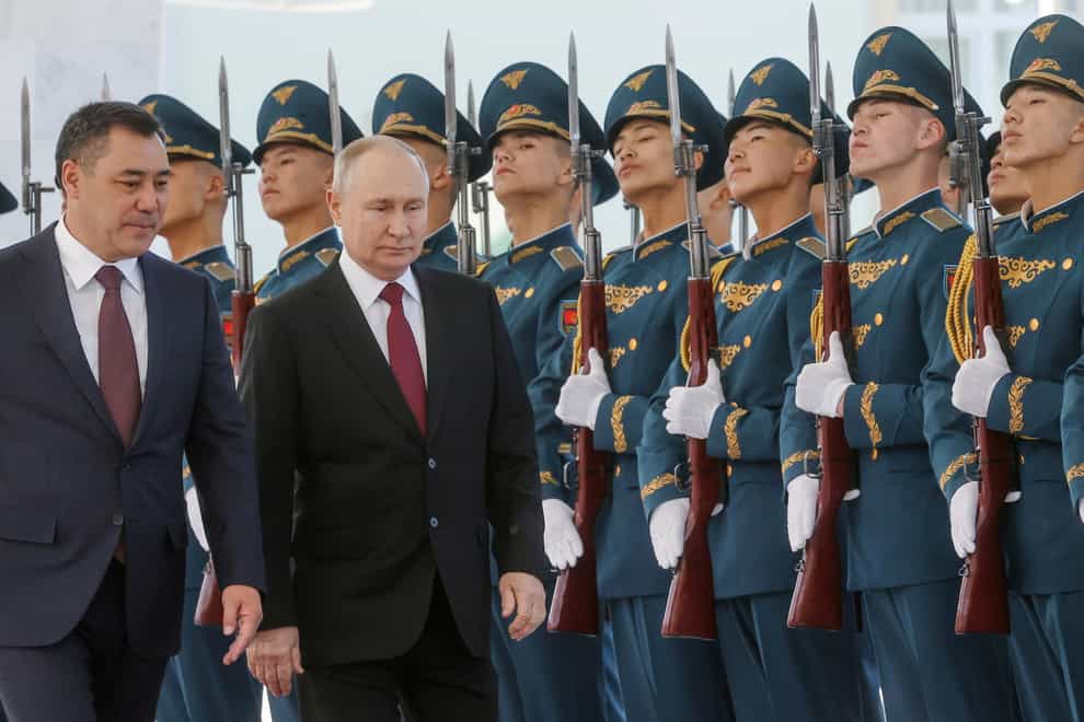 Vladimir Putin received a military welcome as he arrived in Kyrgyzstan (Sergei Karpukhin, Sputnik, Kremlin pool photo via AP)