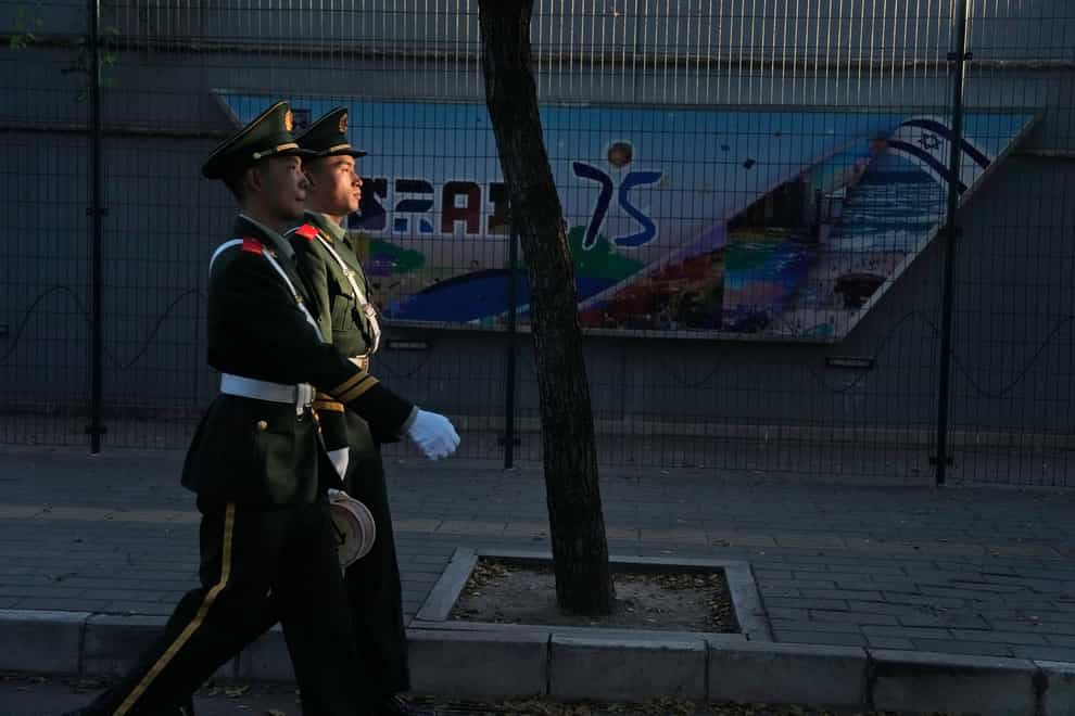 Chinese paramilitary policemen have stepped up patrols outside the Israeli Embassy in Beijing (AP)