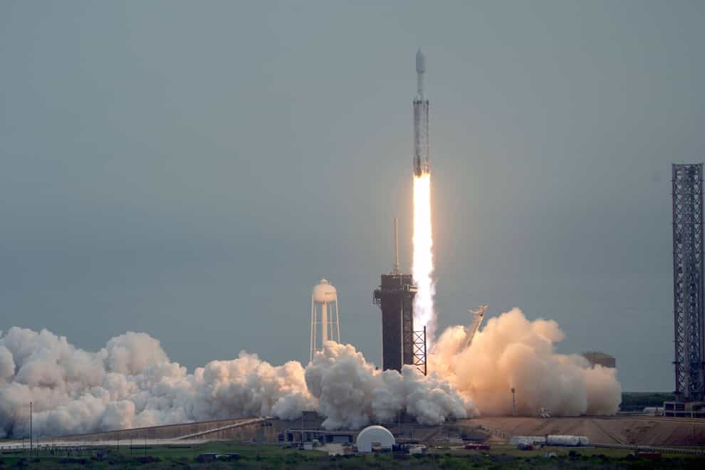 A SpaceX Falcon Heavy rocket lifts off from the Kennedy Space Centre on Friday (John Raoux/AP/PA)