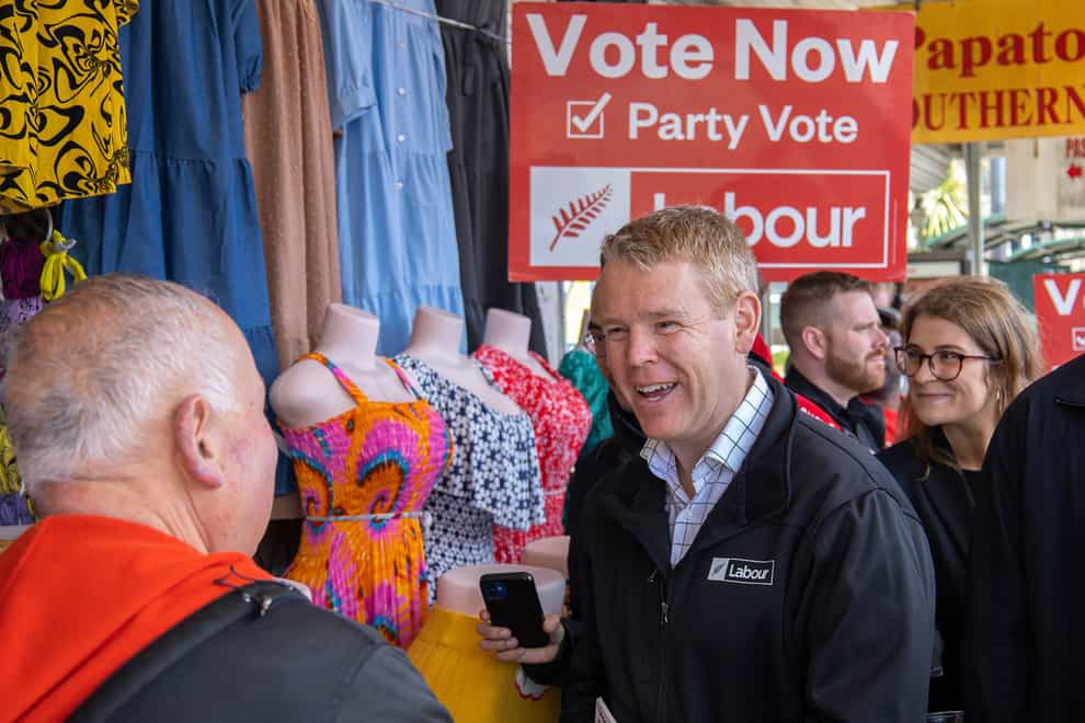 New Zealand’s Prime Minister Chris Hipkins meets people on the street in Auckland ahead of the polls opening in the country’s general election (New Zealand Herald via AP/PA)