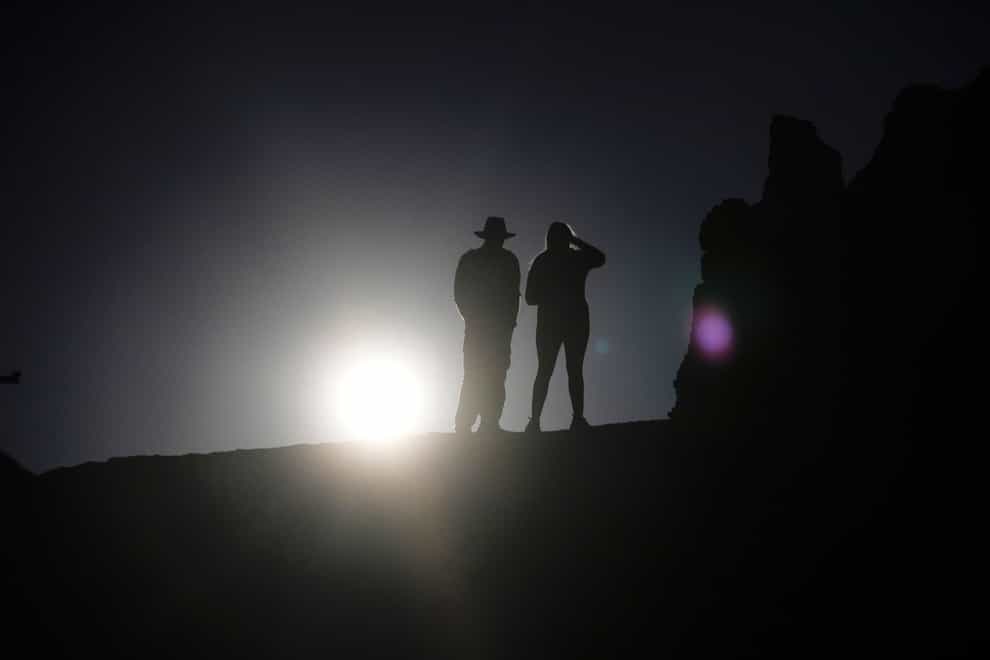 People watch the sun rise over Bryce Canyon National Park, Utah (AP)
